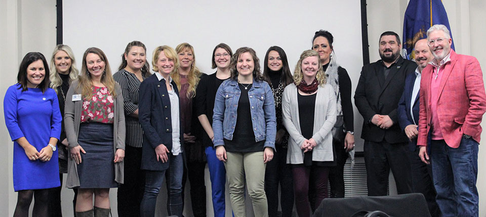 New professionals from the chamber of commerce industry pose after a day long learning session