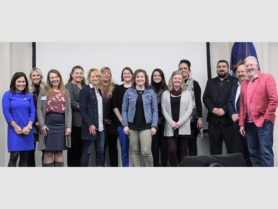 New professionals from the chamber of commerce industry pose after a day long learning session